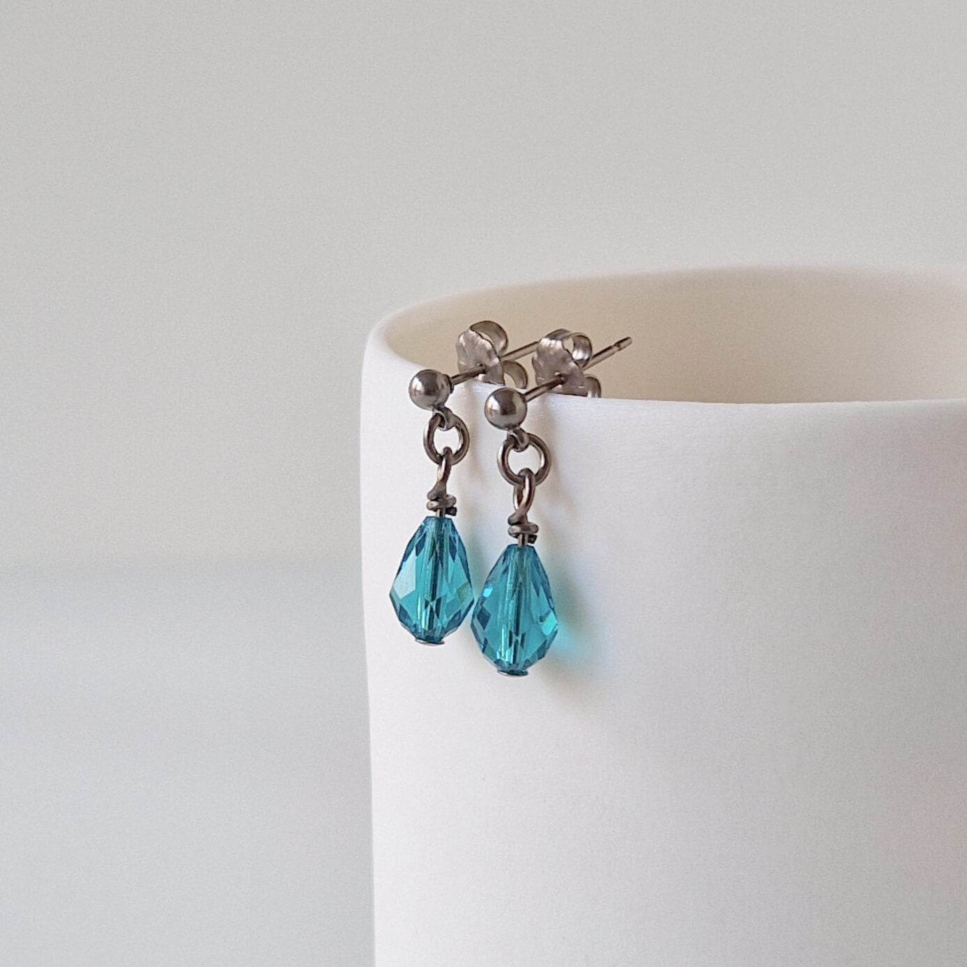 Titanium Stud Earrings with Dangling Blue Zircon Crystal Teardrops