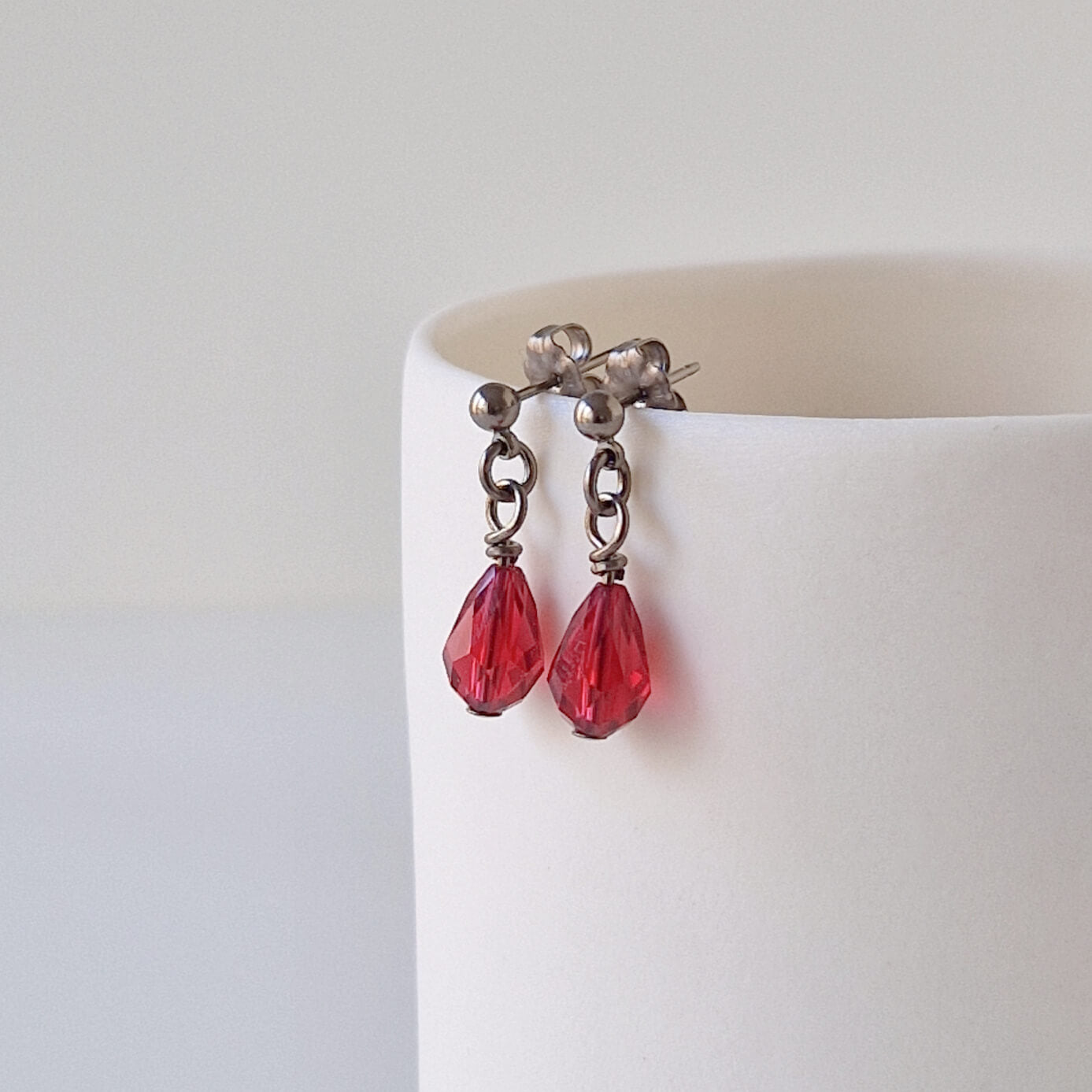 Titanium Stud Earrings with Dangling Ruby Red Crystal Teardrops