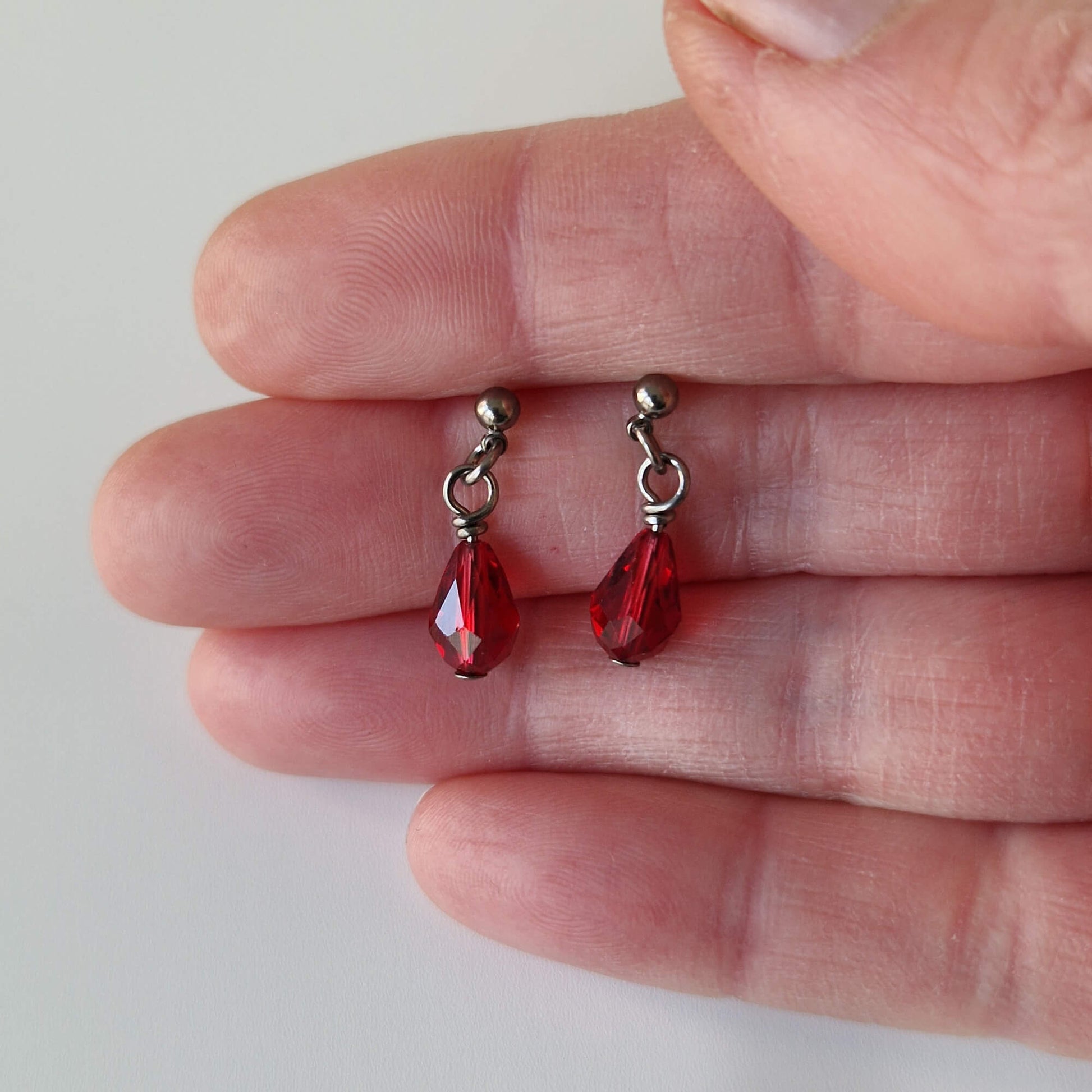 Titanium Ball Studs with Dangling Ruby Red Crystal Droplets