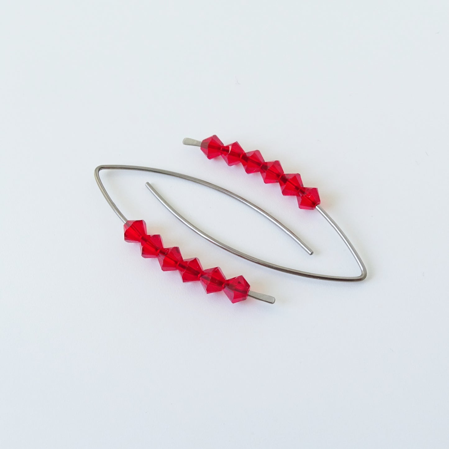 Niobium Earrings with Red Crystals