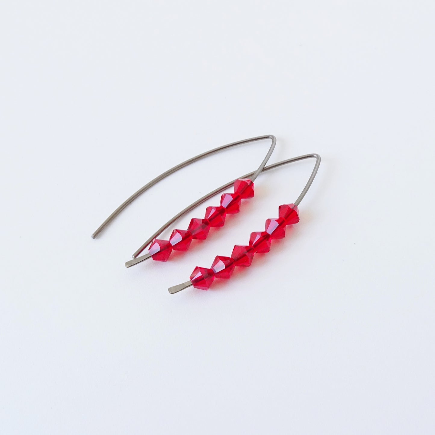 Niobium Earrings with Red Crystals