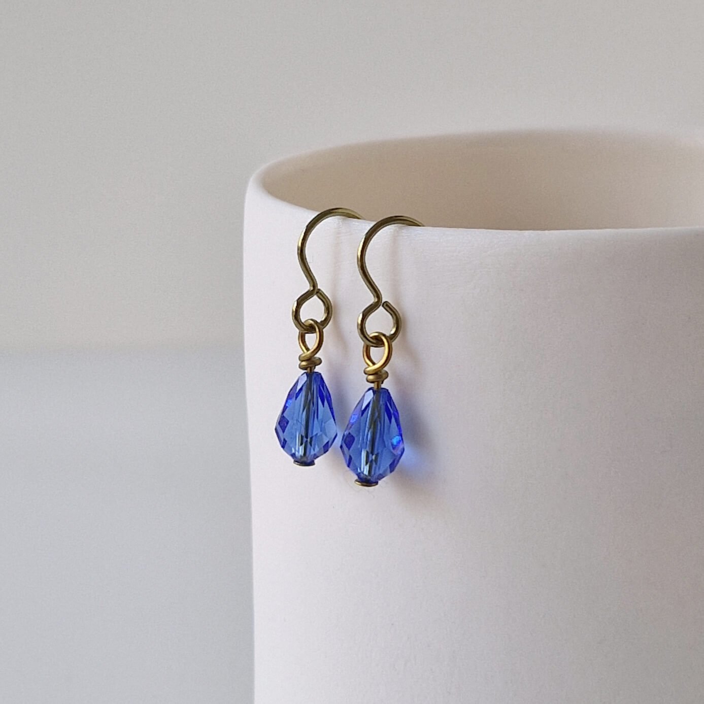 Gold Titanium Earrings with Sapphire Blue Crystal Teardrops