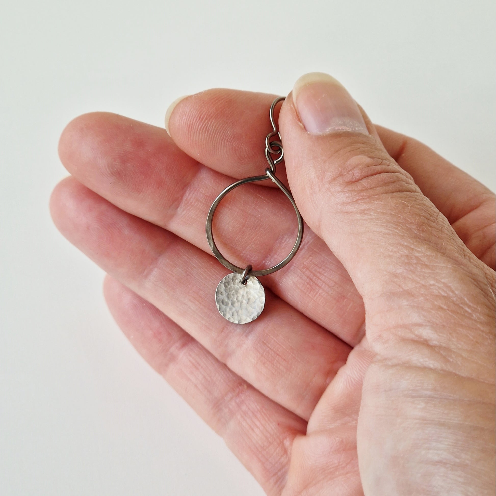  Titanium Earrings Open Circle with Tiny Disc on Hand