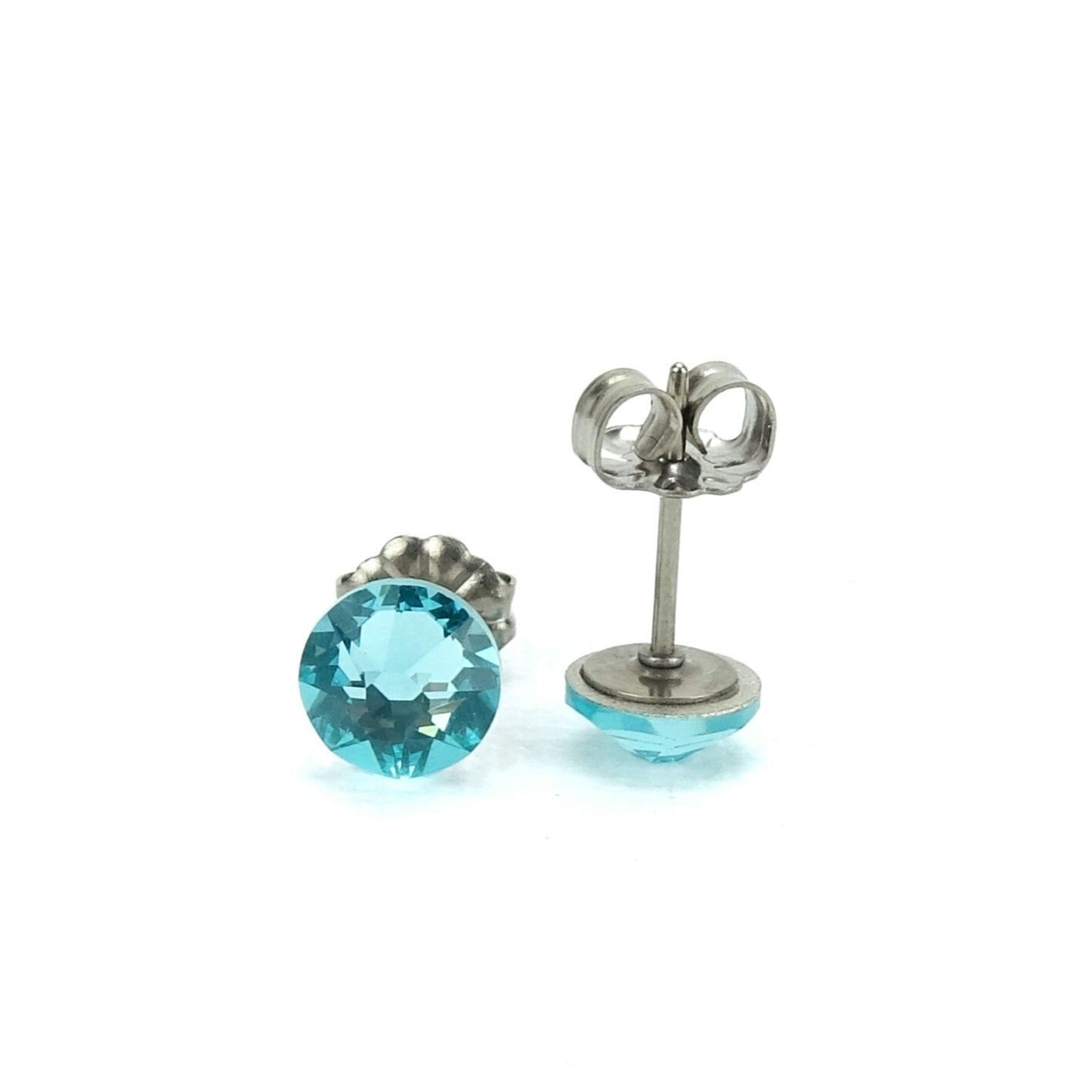 A pair of blue gemstone earrings with a silver post and earring backs.
