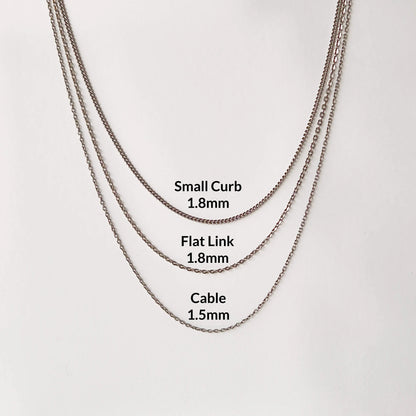 Three different Titanium chain style necklaces to choose from, each labeled with the corresponding necklace width in millimeters: Small Curb (1.8mm), Flat Link (1.8mm), and Cable (1.5mm).