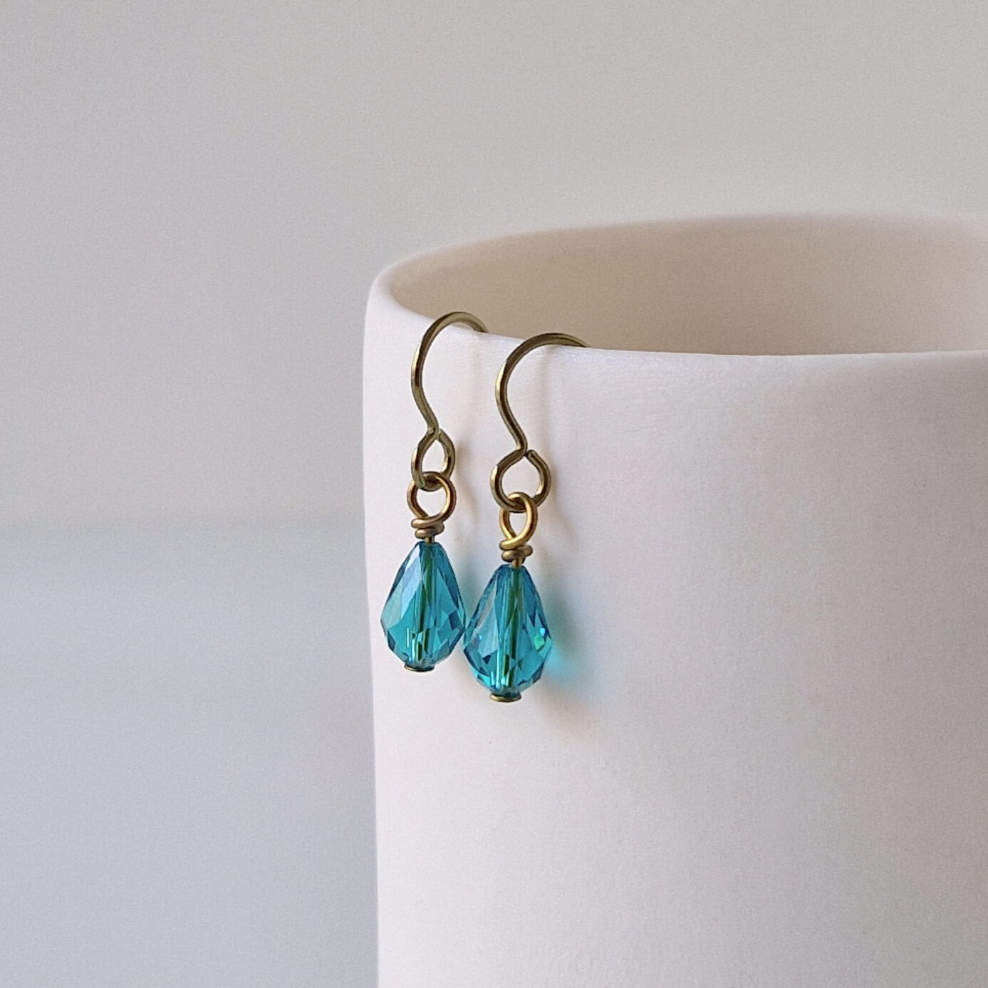 Gold Titanium Earrings with Blue Zircon Crystal Teardrops