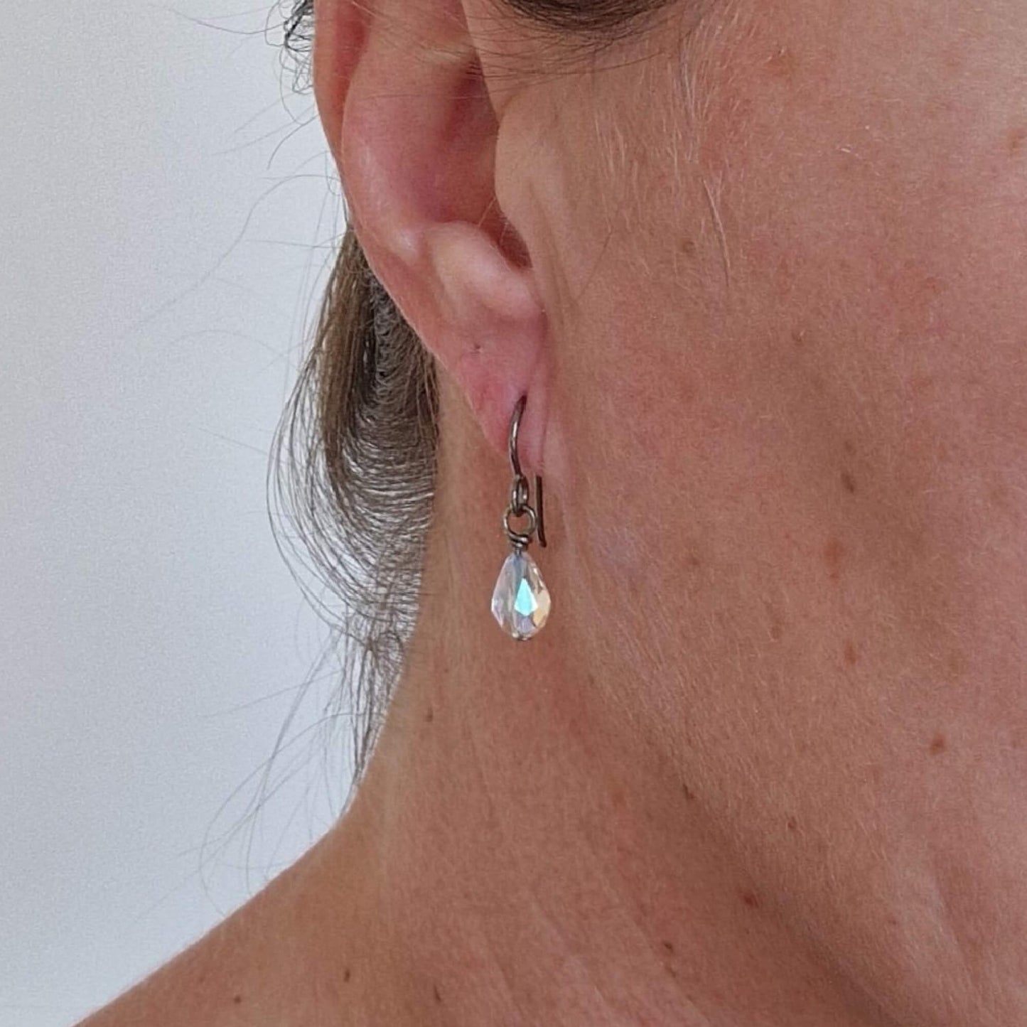 Pure Titanium Earrings with Crystal Shimmer Teardrops Shown in Ear