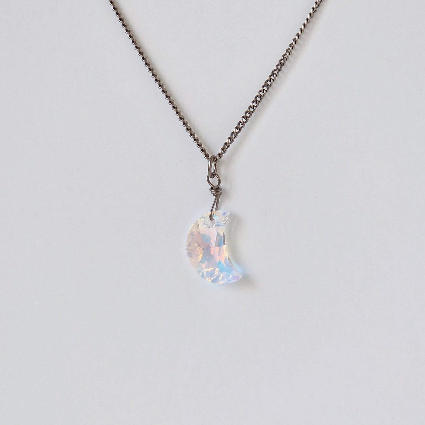 Small Aurora Borealis Moon Crystal Titanium Necklace