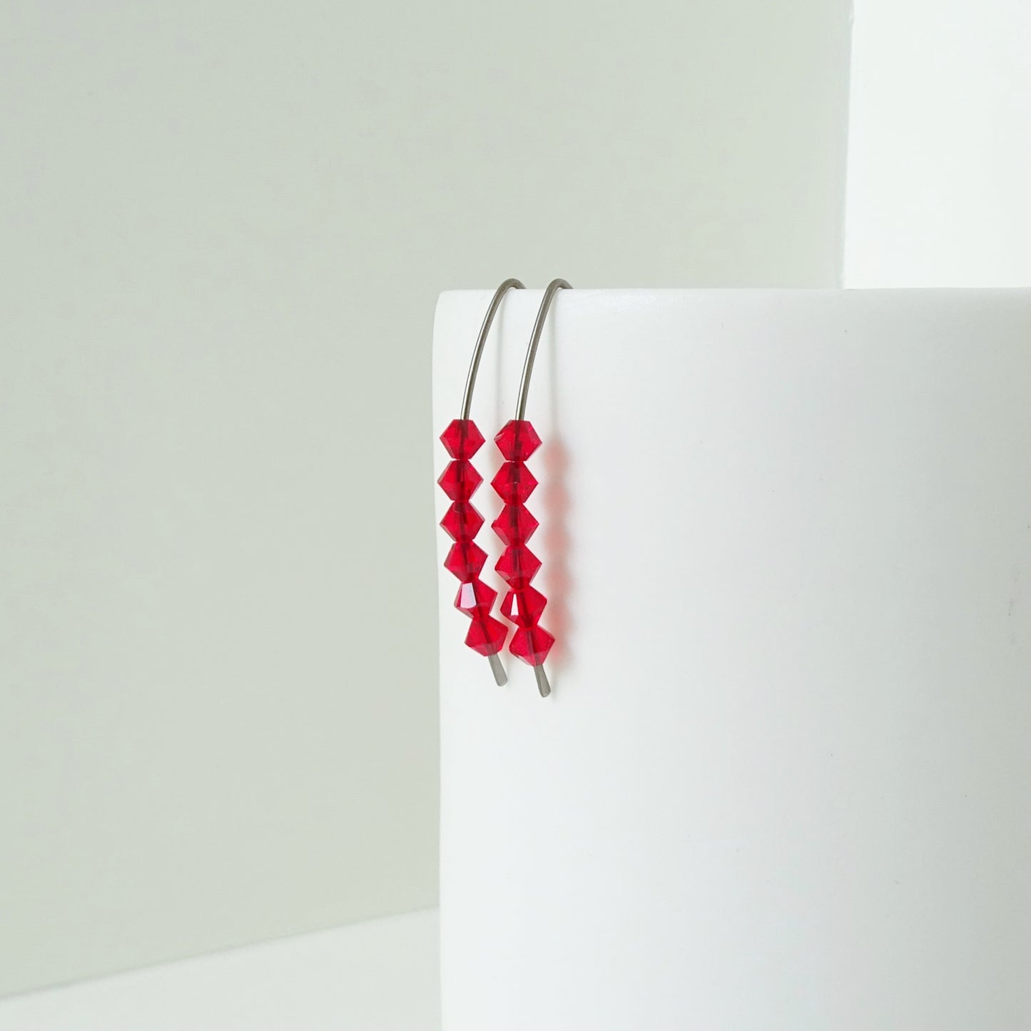 Niobium Earrings with Red Crystals