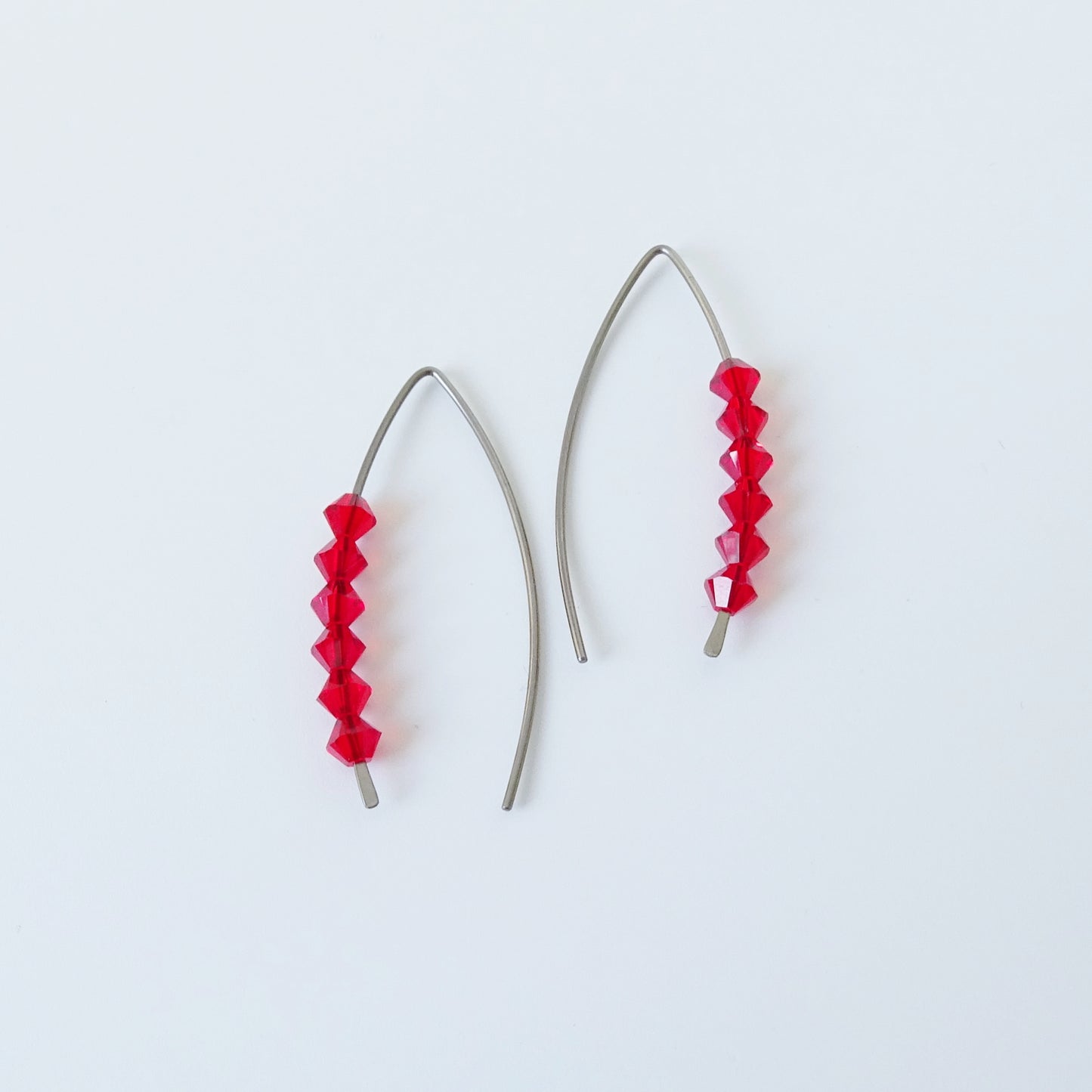 Niobium Earrings with Red Crystals